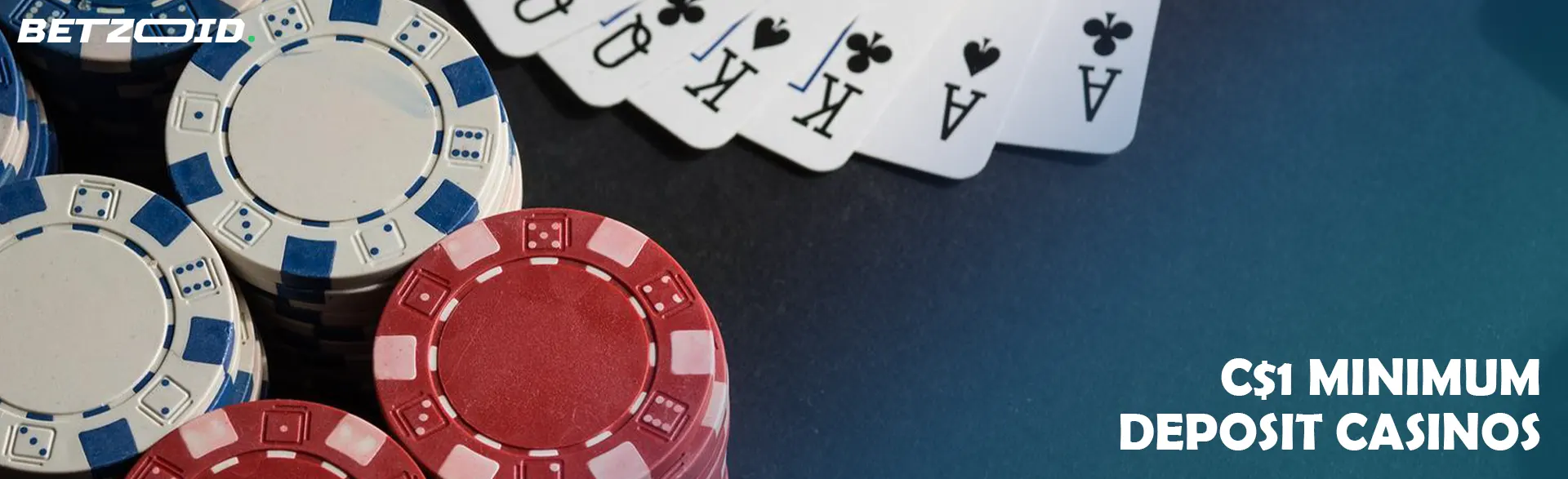 Casino chips next to playing cards.