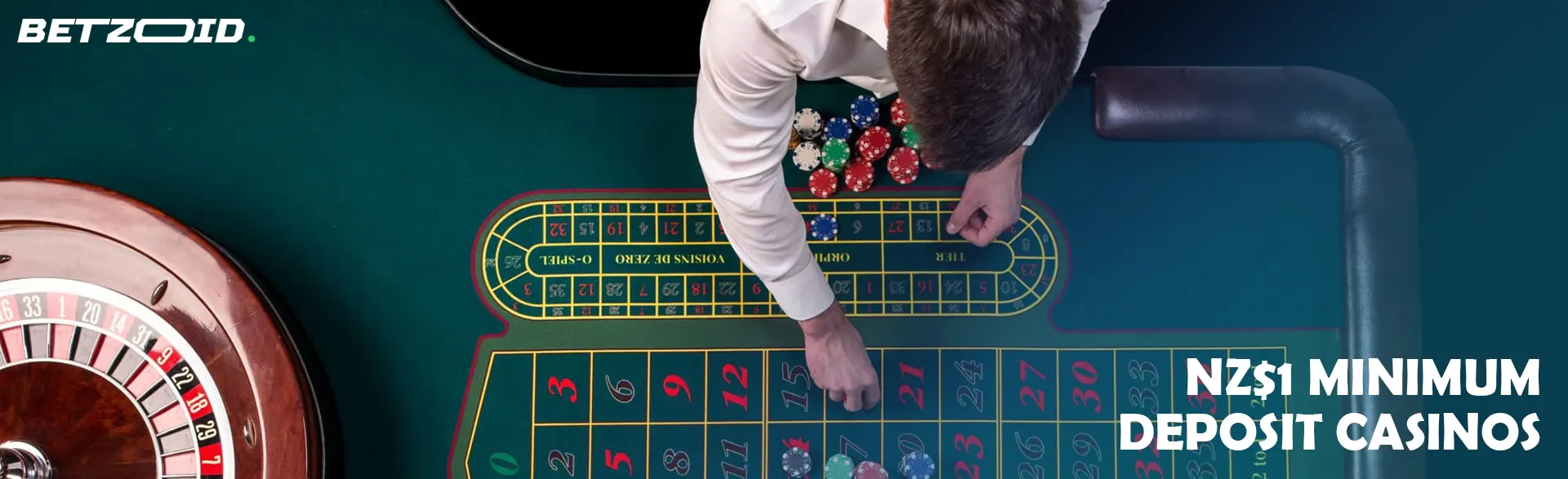 The croupier places the chips on the roulette table.