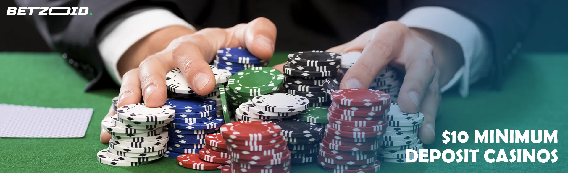 The player holds a pile of chips in his hands.