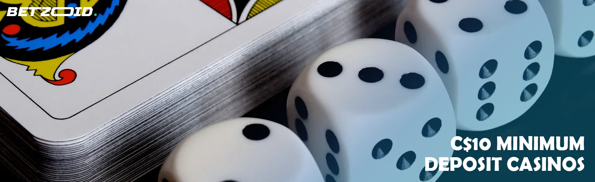 Playing dice next to a deck of cards.