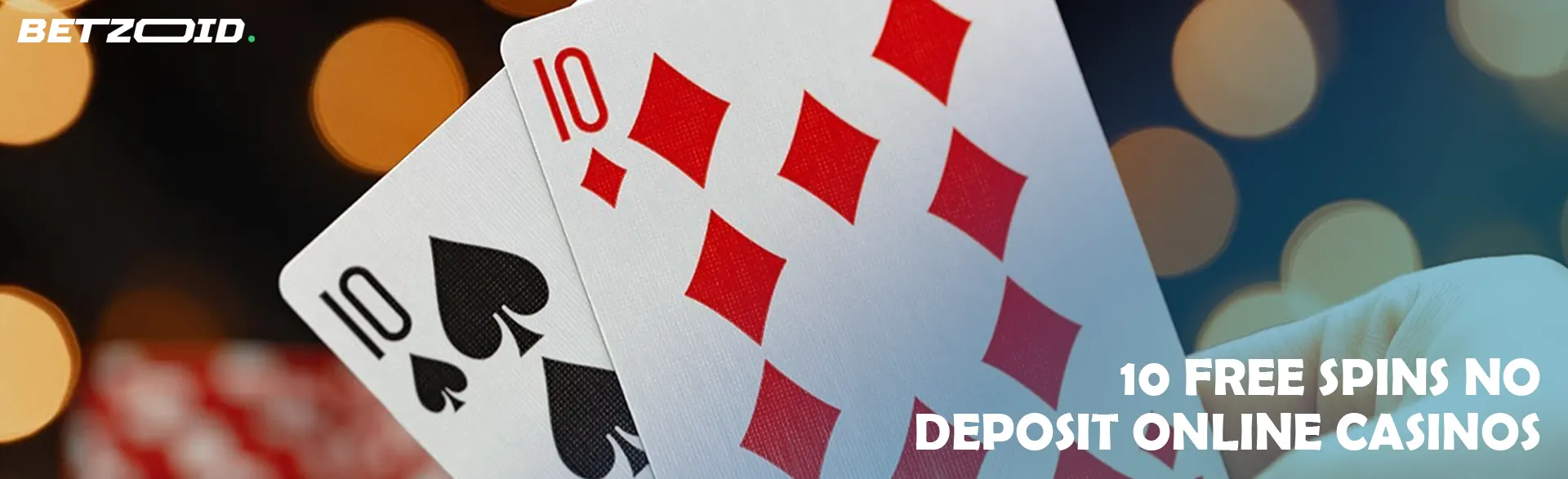 Two cards on the background of casino lights.