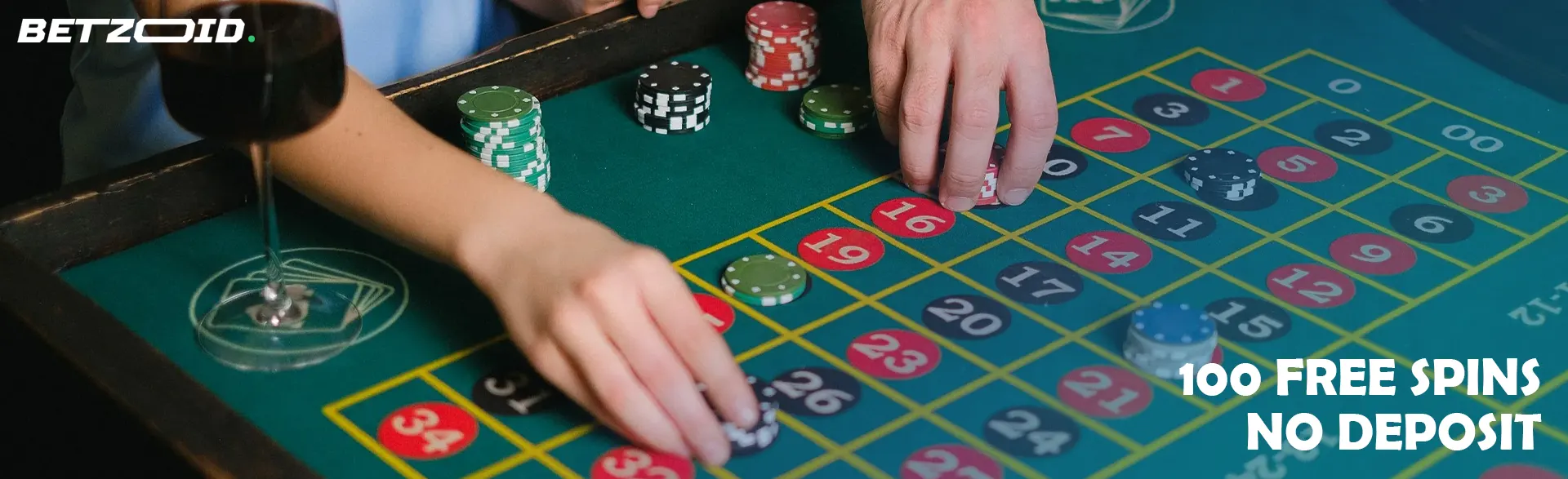 Players place bets with chips on a casino table.