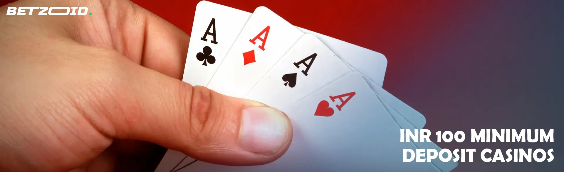 The player is holding cards on a red background.