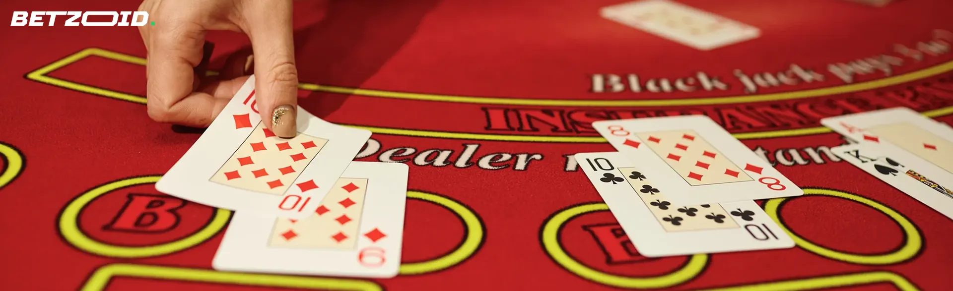 The player places the cards on the blackjack table.