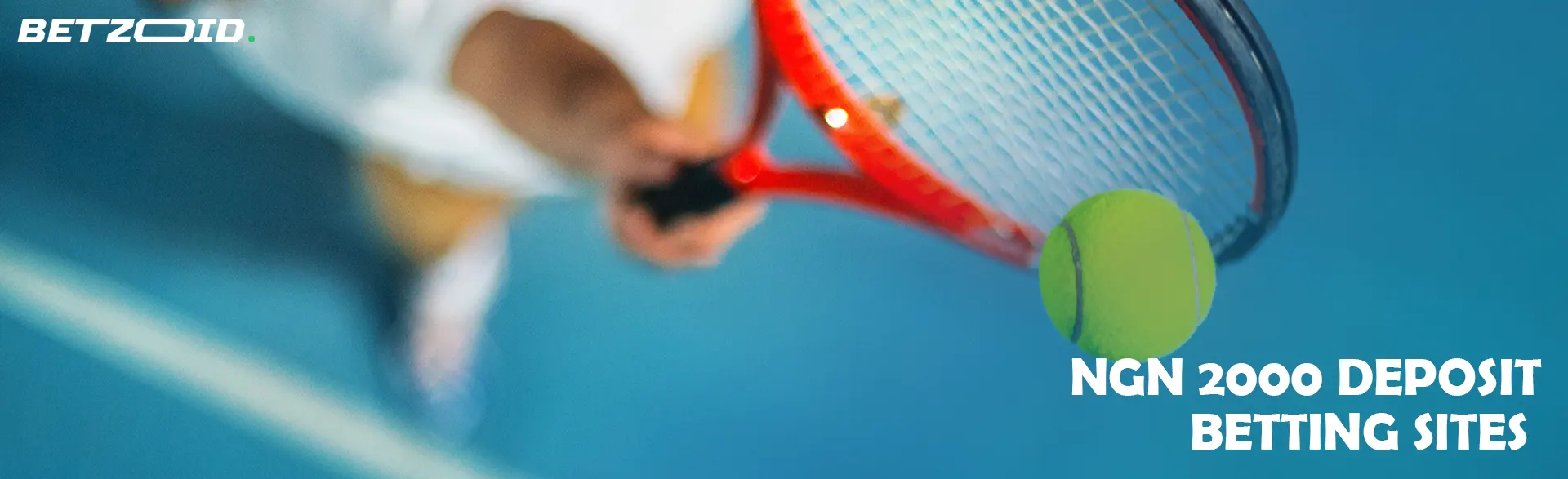 A tennis player is preparing to hit the ball with a racket.
