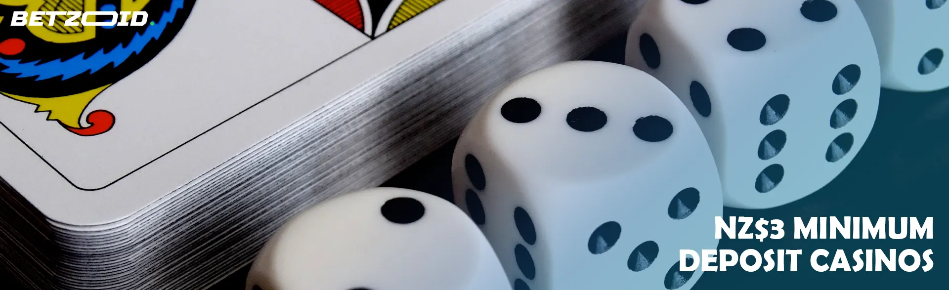 Dice next to a deck of cards.