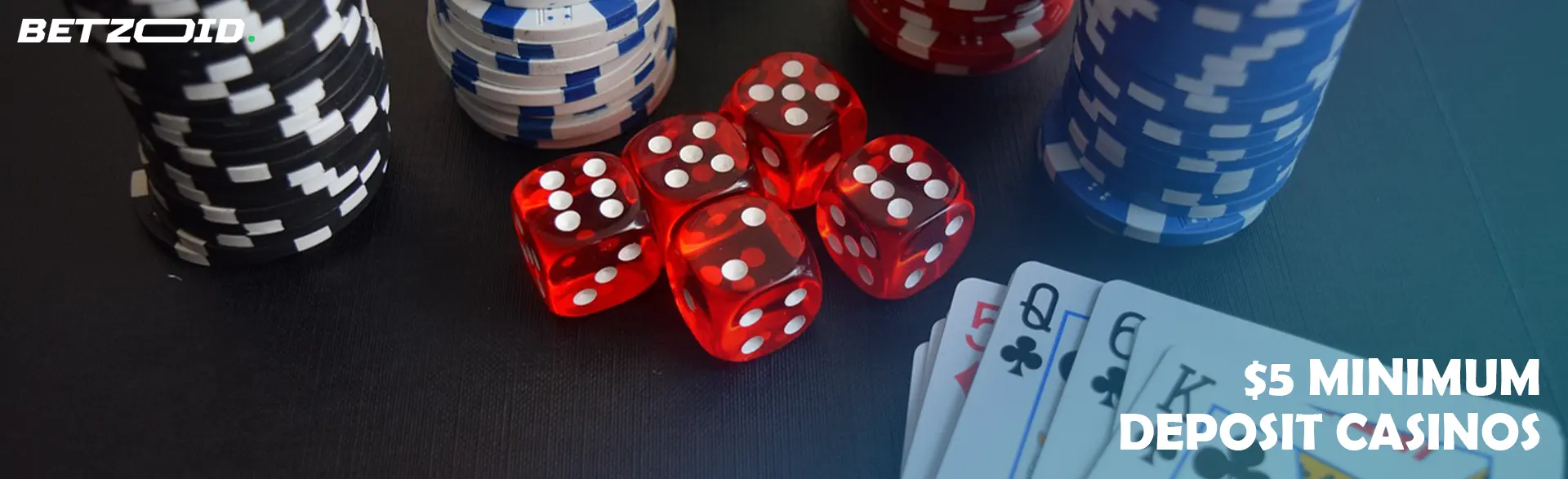 Playing dice and cards next to a stack of chips.
