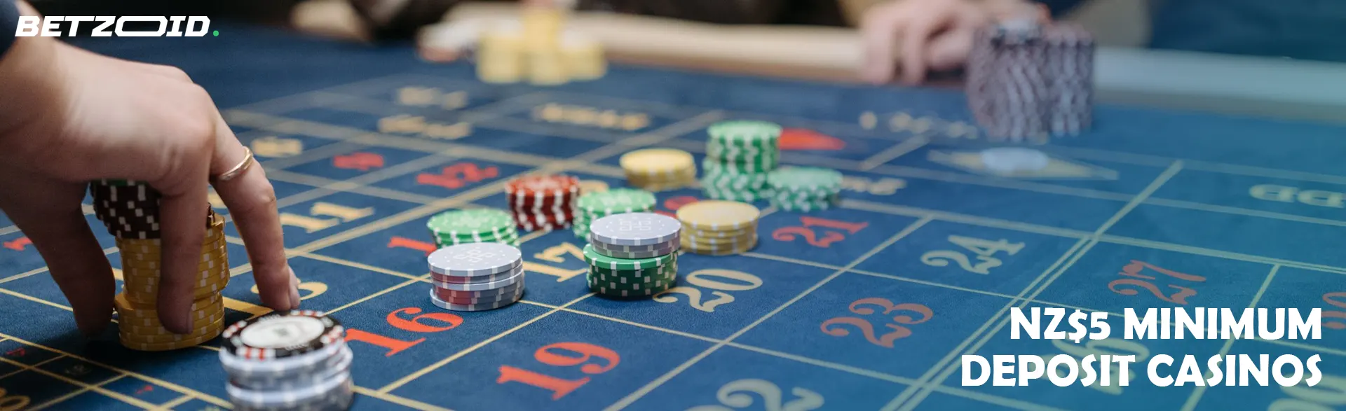 A player places chips on the casino table.