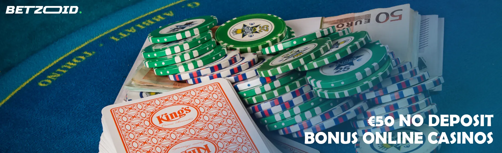 A pile of cards, chips and money on a casino table.