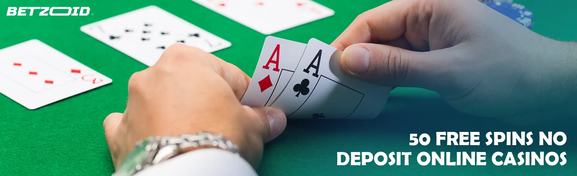 A player holds cards on the casino table.