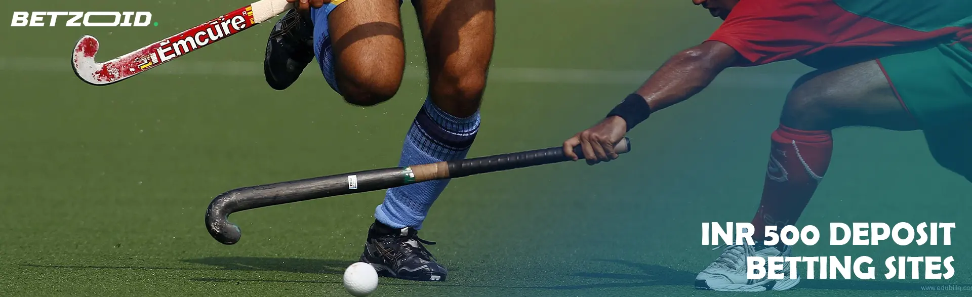 Field hockey players in action during a game.