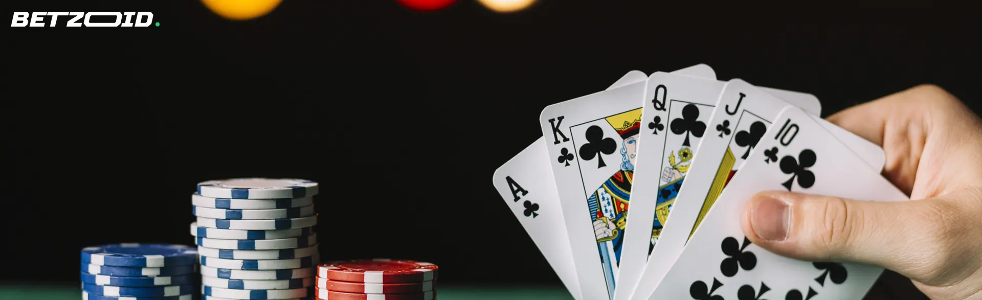 A hand with a straight flush next to the chips.