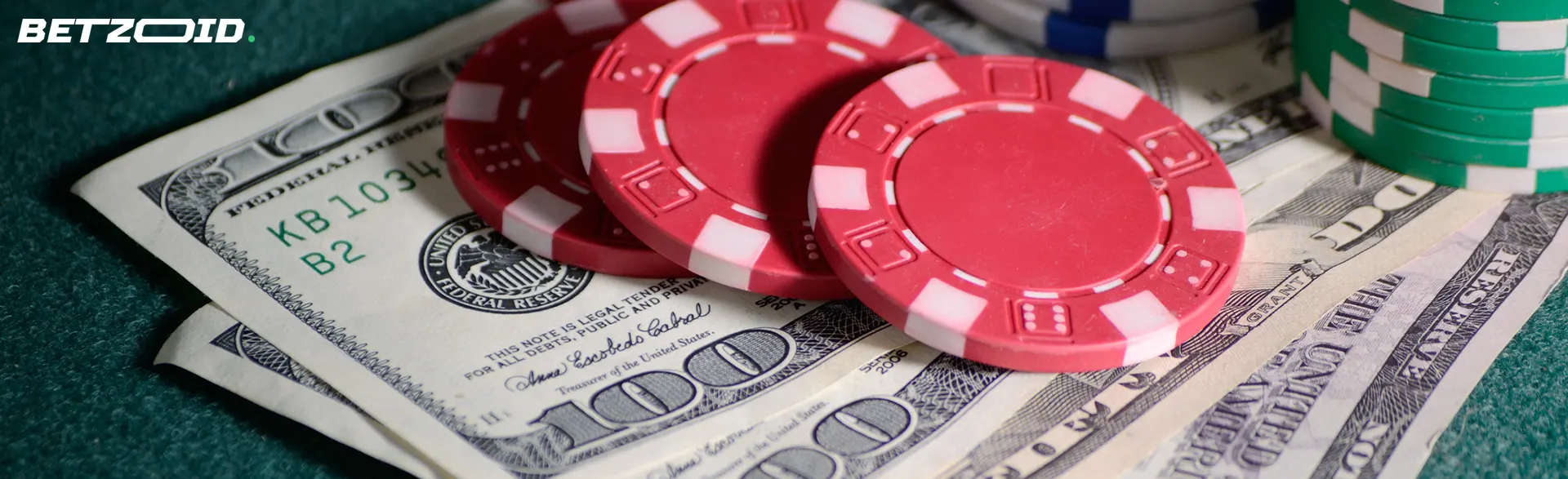 Casino chips lie on dollar bills.