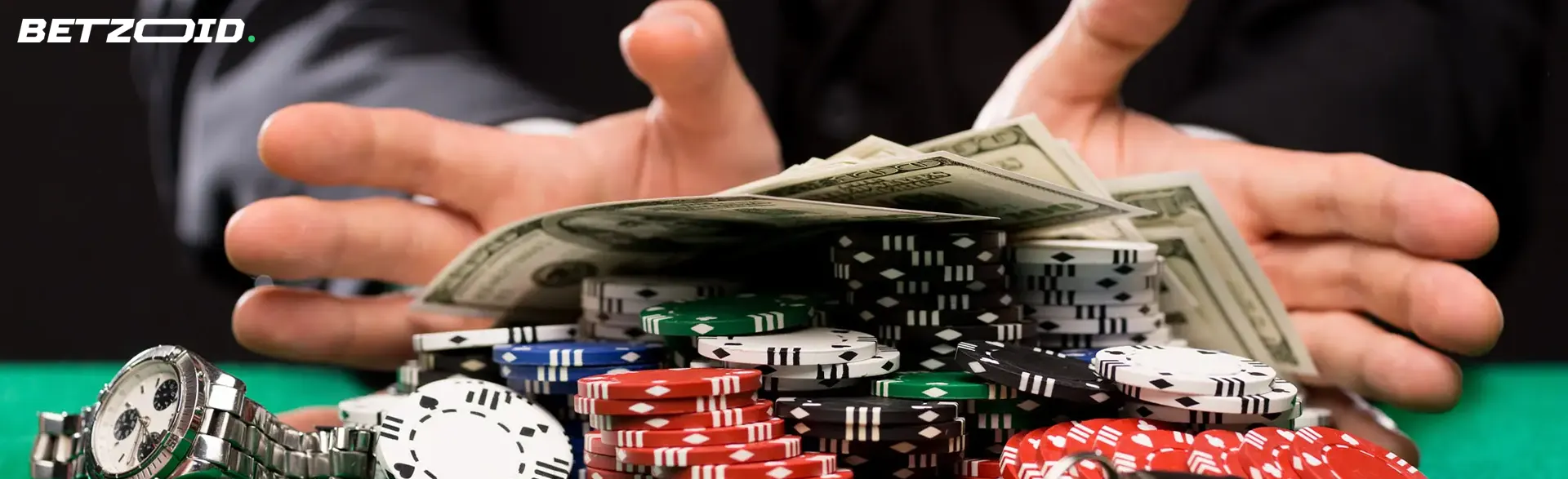 Casino chips and bills in player's hands.