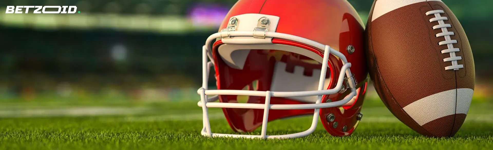 Americký fotbal helma a míč na hřišti.