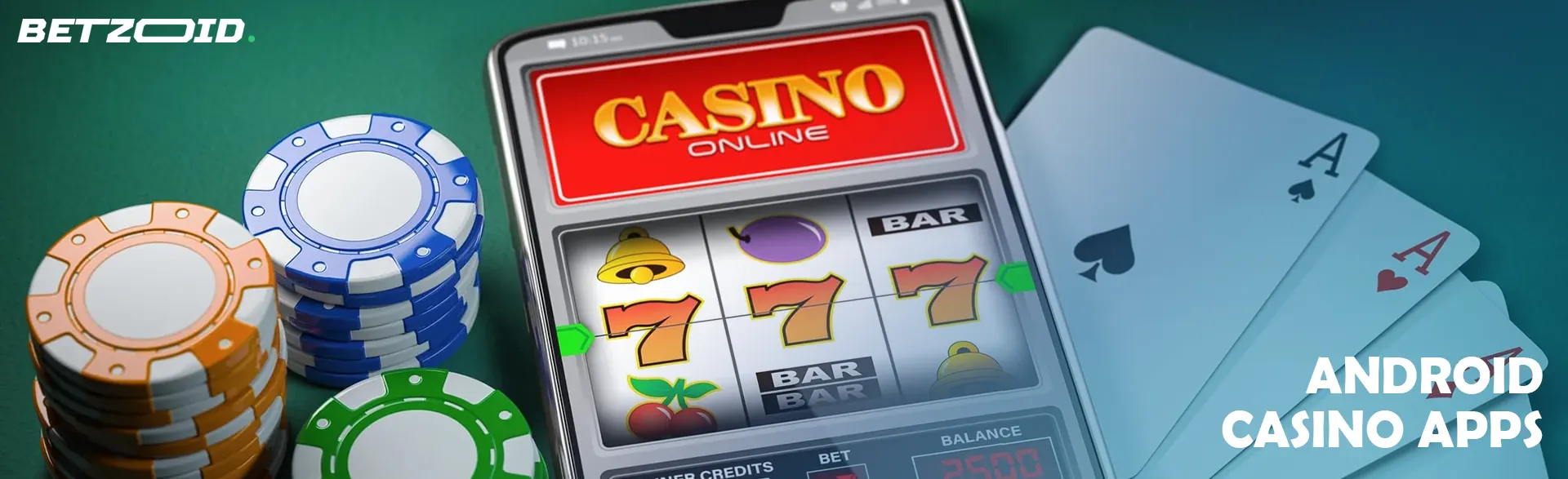 Smartphone with online casino, poker chips and cards nearby.