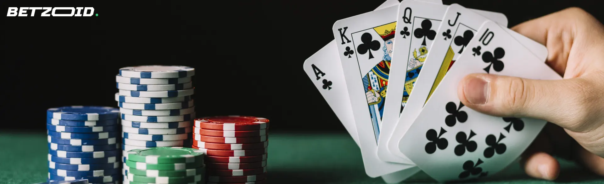 Cards in the player's hand next to casino chips.