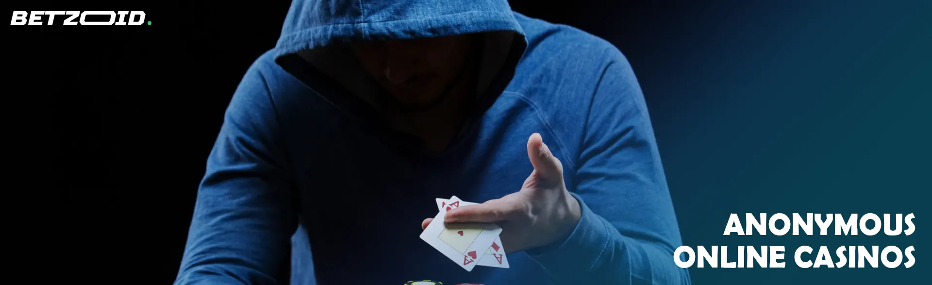 A hooded player holds cards.