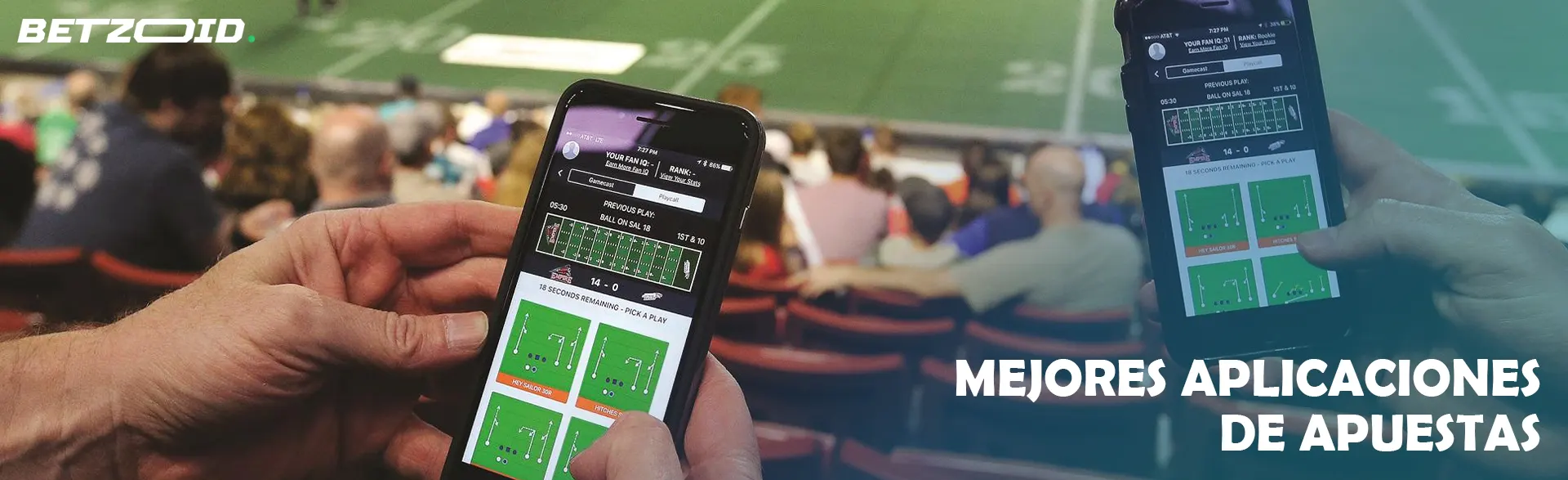 Persona usando aplicación de apuestas en un estadio.