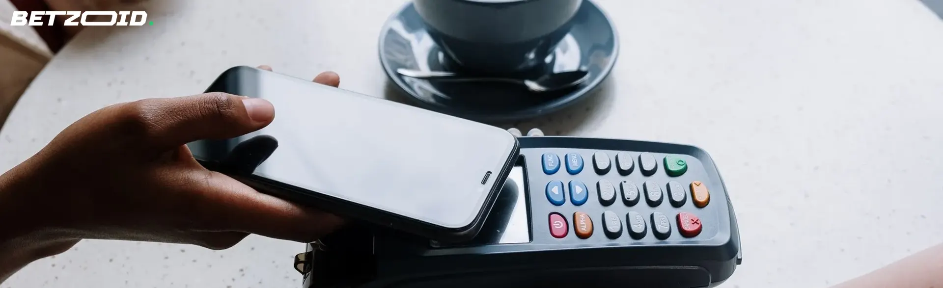 A person makes a payment via Apple Pay.