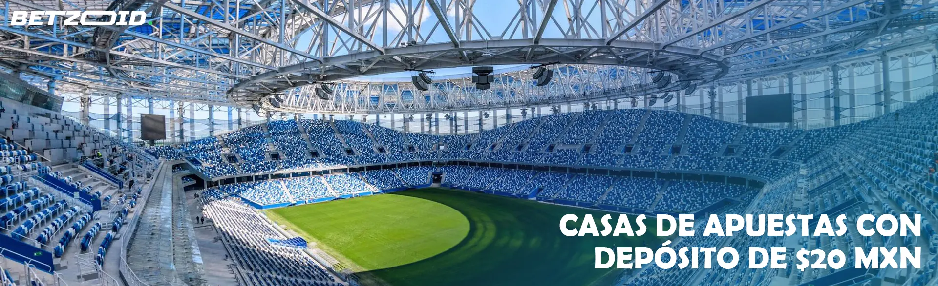 Un gran campo de fútbol moderno con gradas vacías.