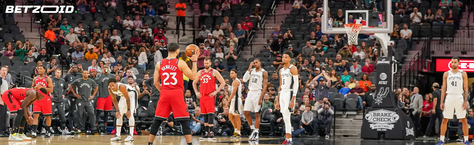Basketball players in action during the game.