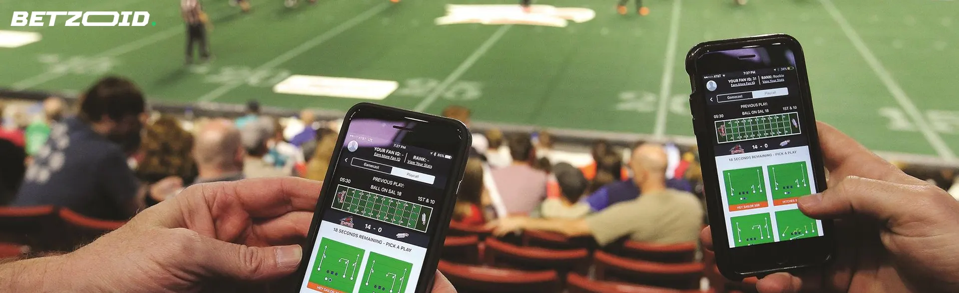 People place bets on their phones while sitting in the stands.