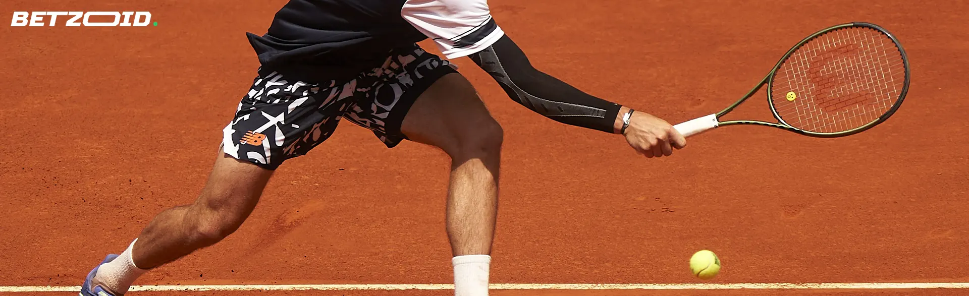 A tennis player tries to hit the ball.
