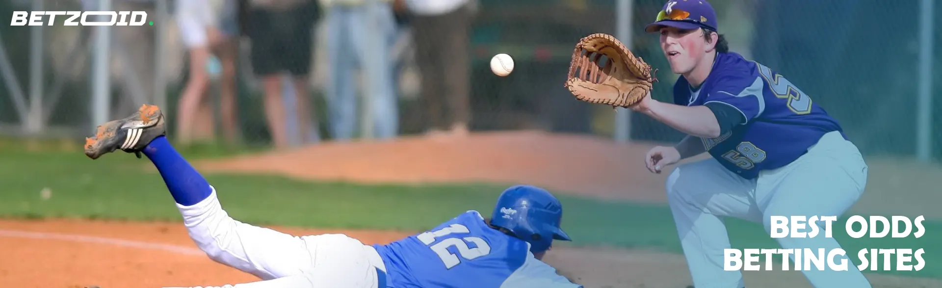 A baseball player catches the ball on the field.