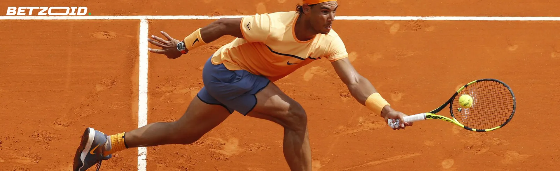 A tennis player tries to hit the ball.