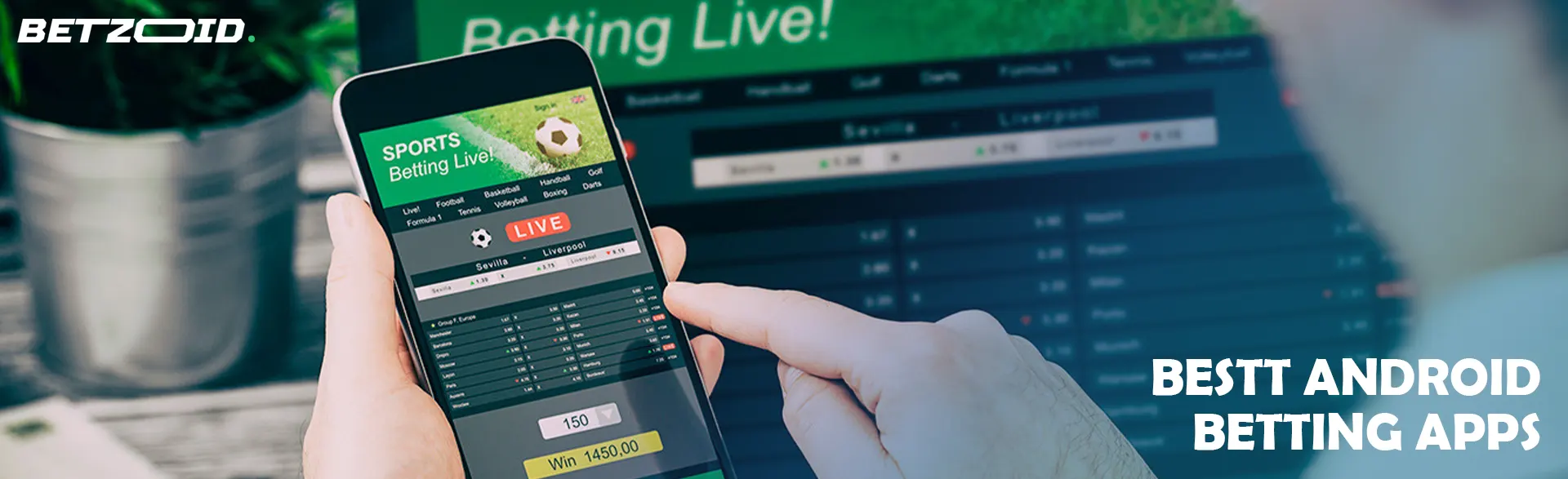 A man is holding a phone with a betting application.