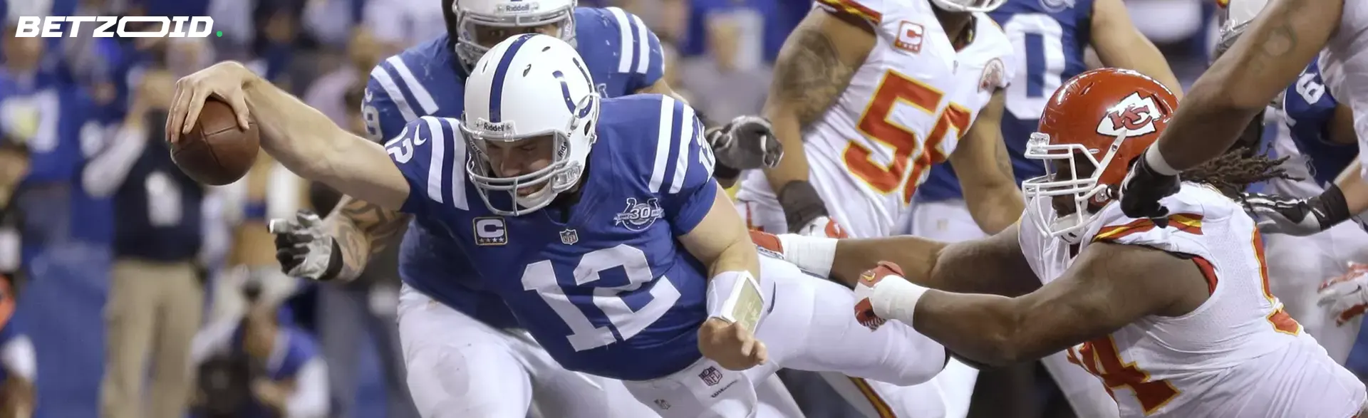American football players fight for the ball.