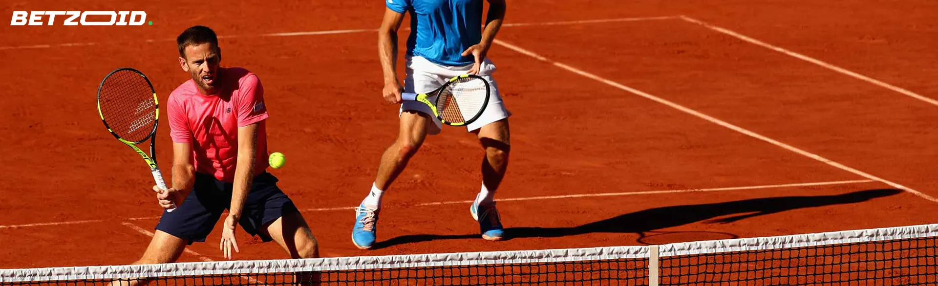 Tennis players in action during a match.