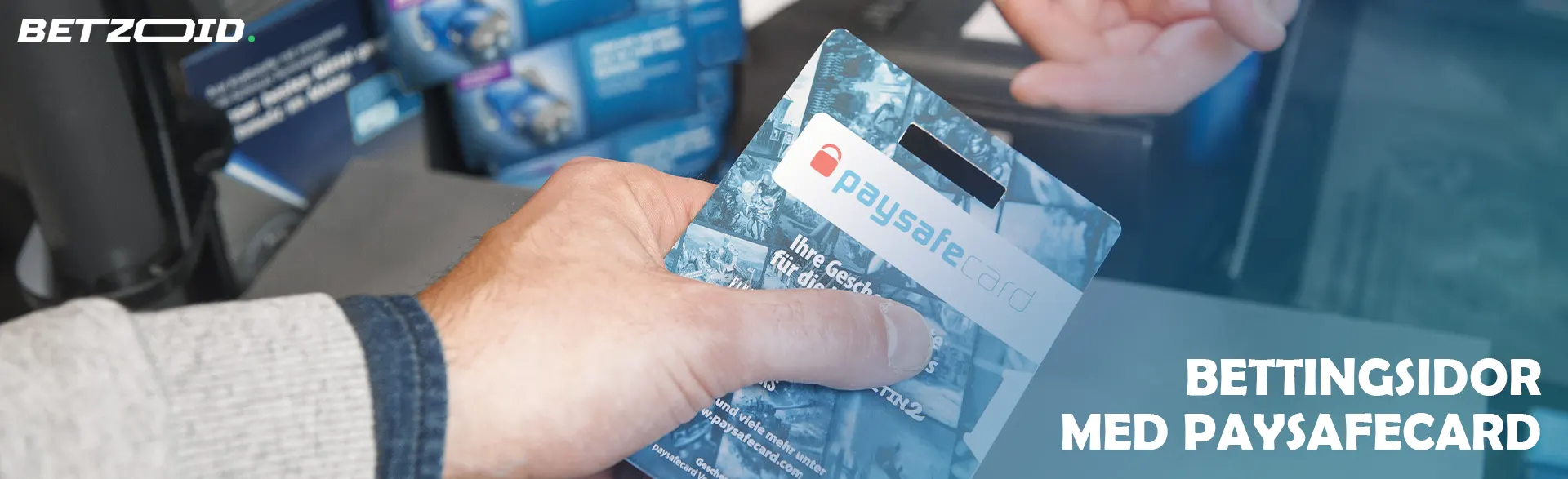 Hand håller ett Paysafecard vid kassan.