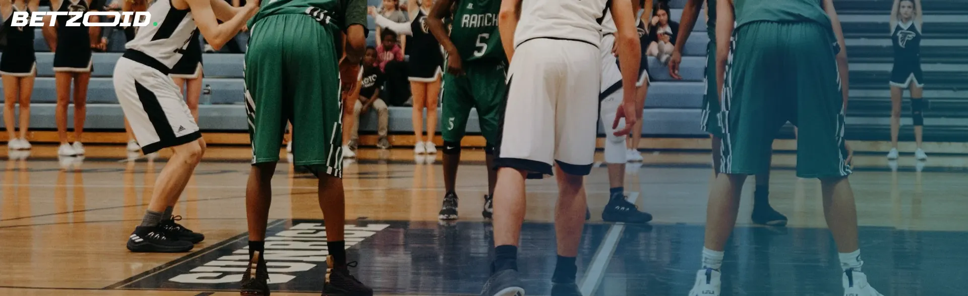 Basketball players' feet in motion.