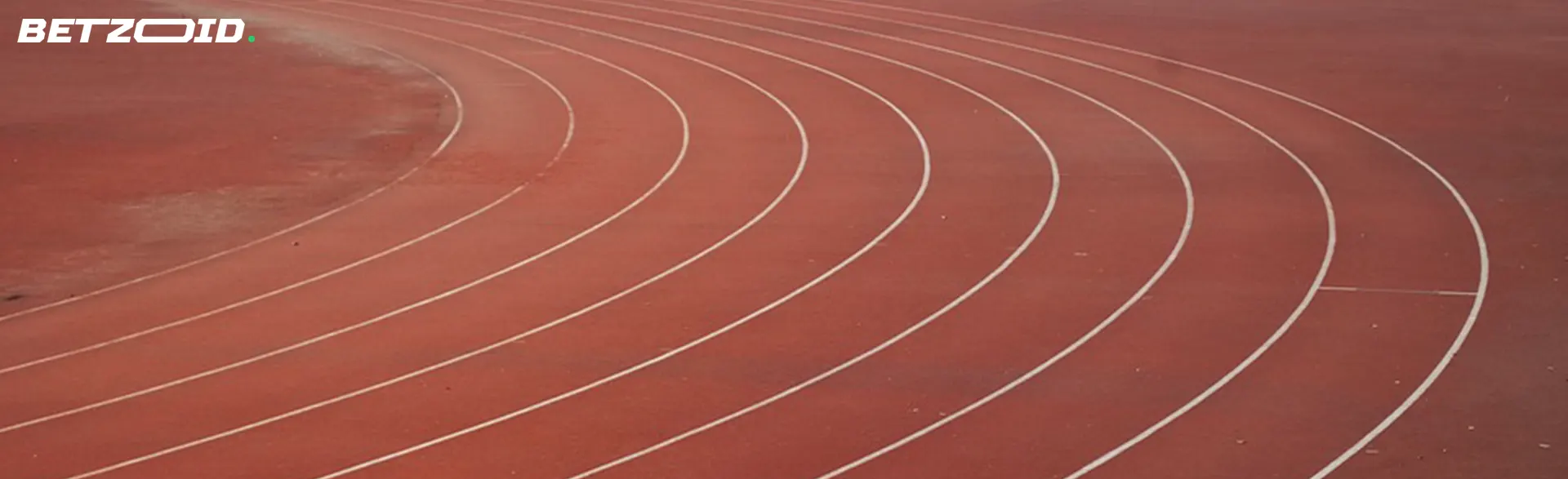 Curved lanes of a red running track.