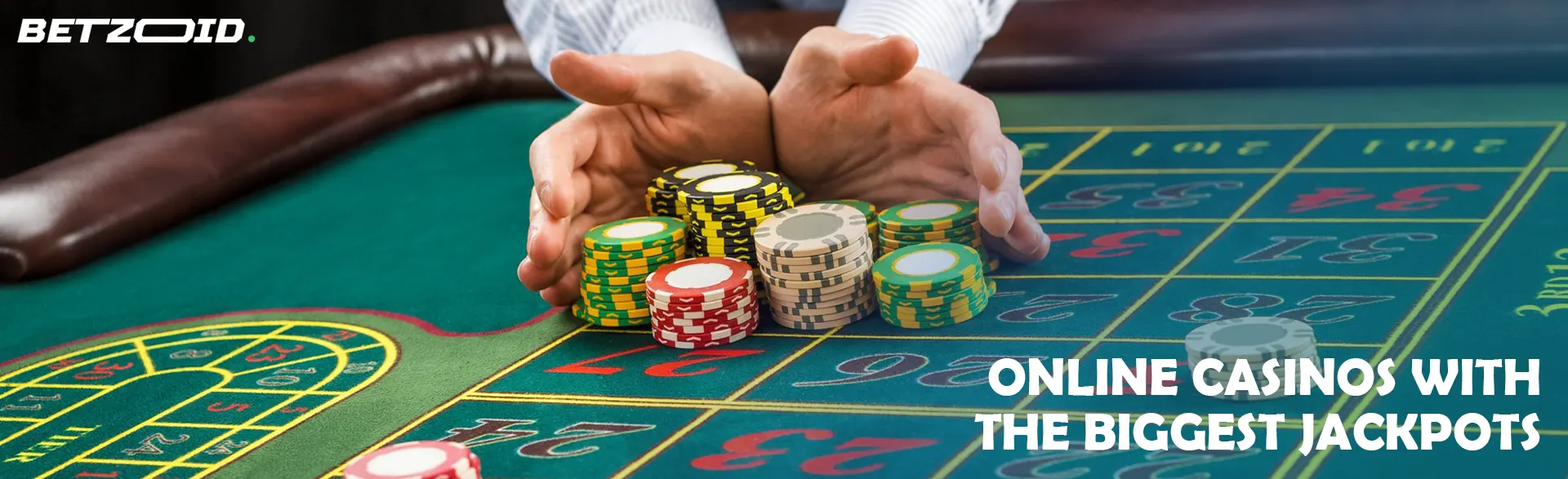A pile of chips in the hands of a player on a casino table.