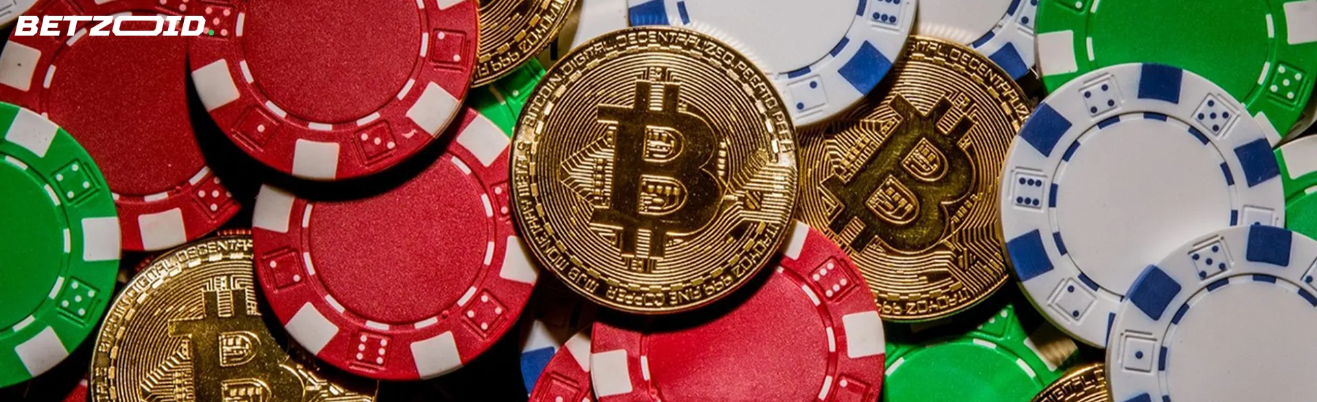 Cryptocurrency coins lie on a pile of casino chips.