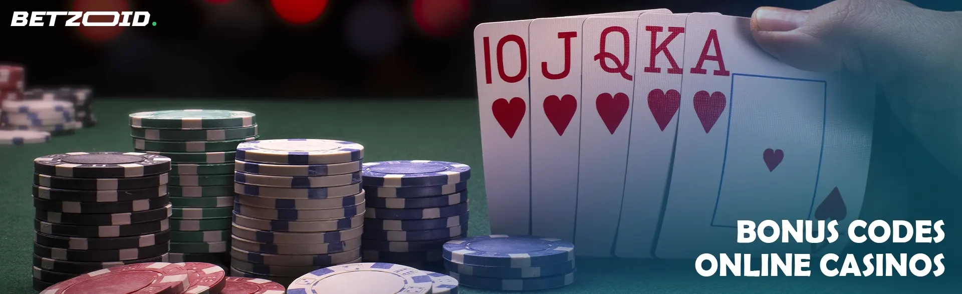 The player holds the cards next to the casino chips.