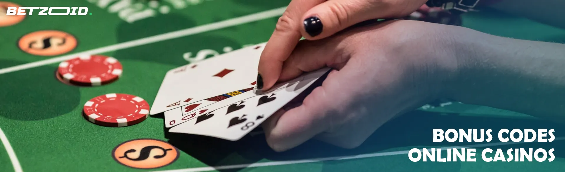 A player holds cards over a casino table.