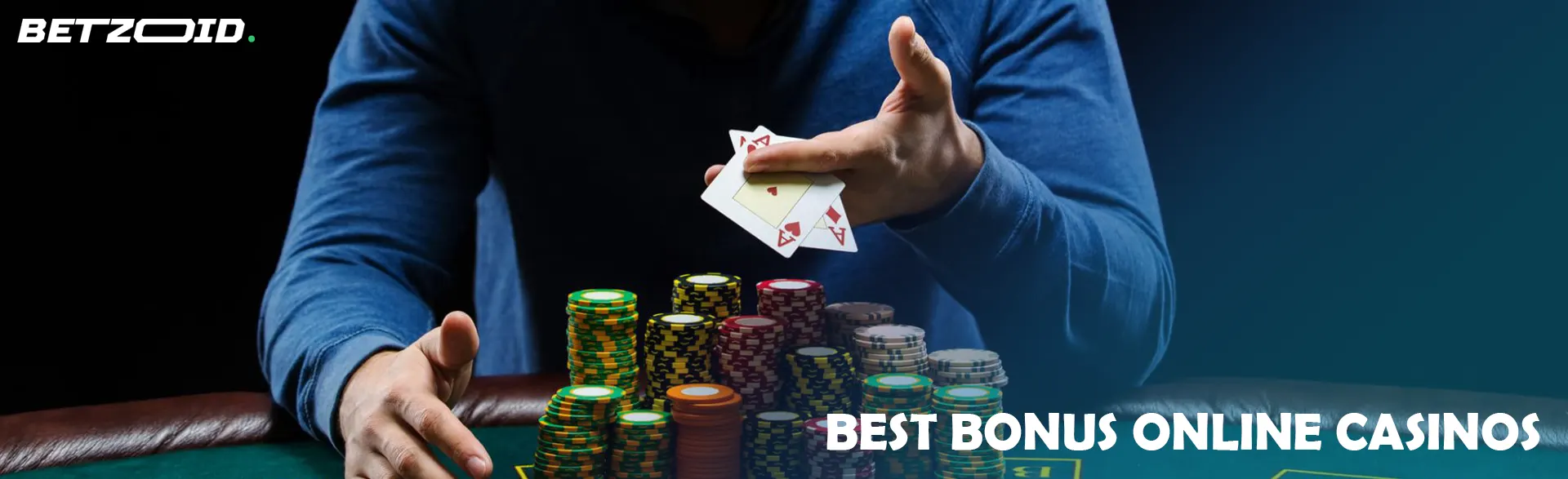 A player holds cards over a pile of casino chips.