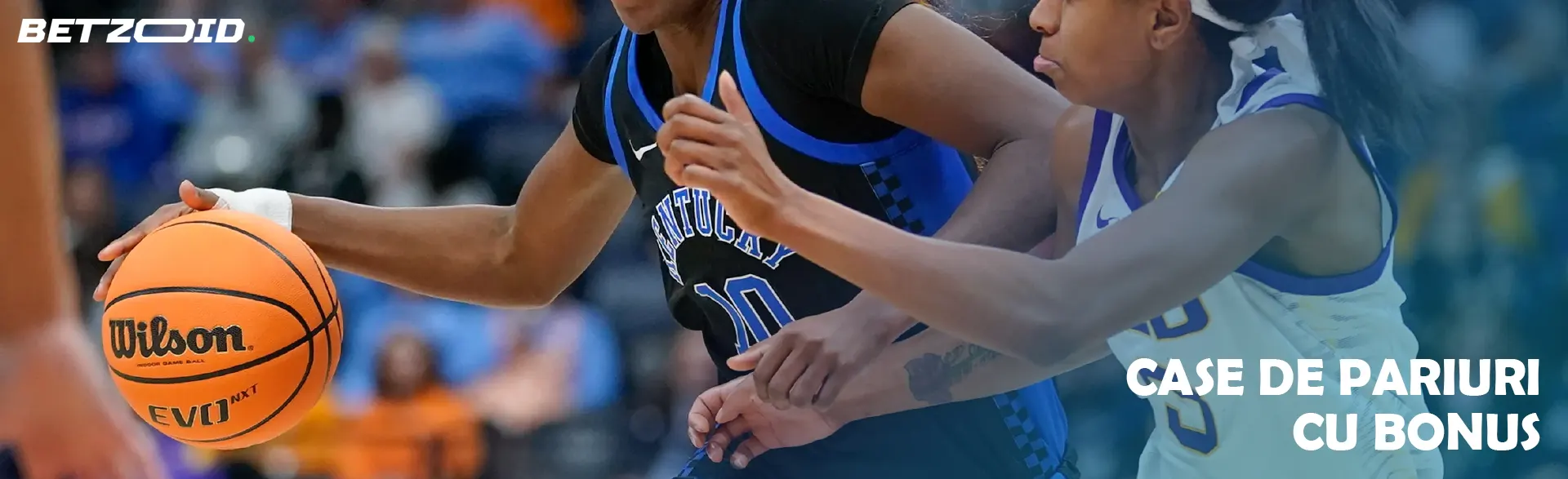 Jucători de baschet în acțiune în timpul jocului.