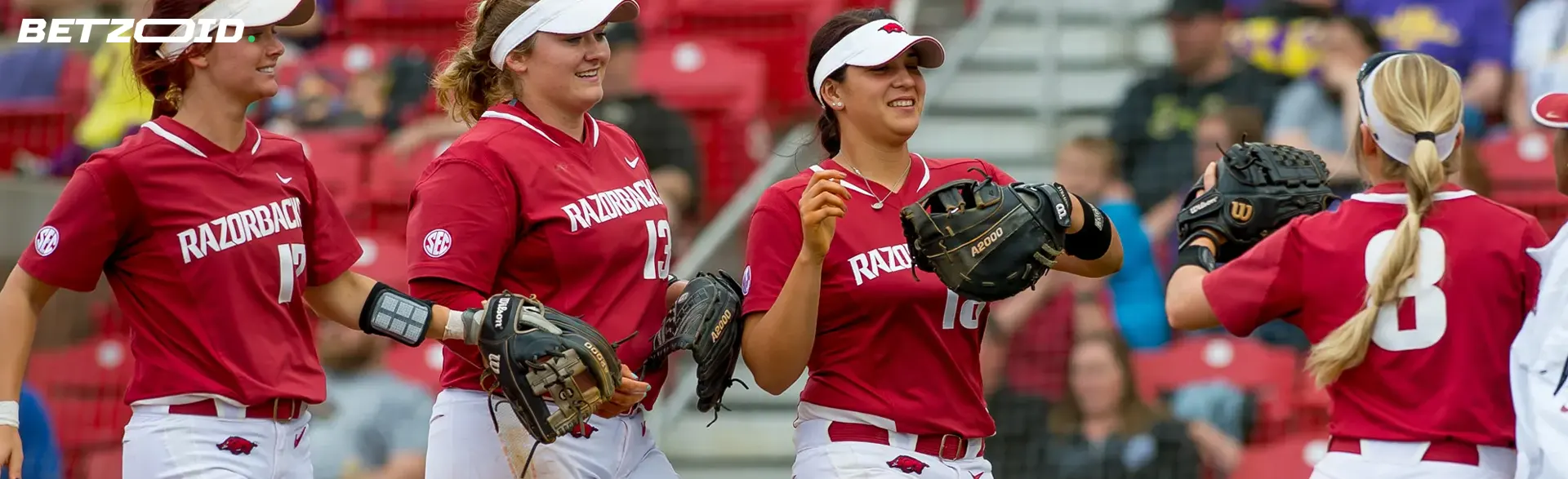 The softball team celebrates a victory.