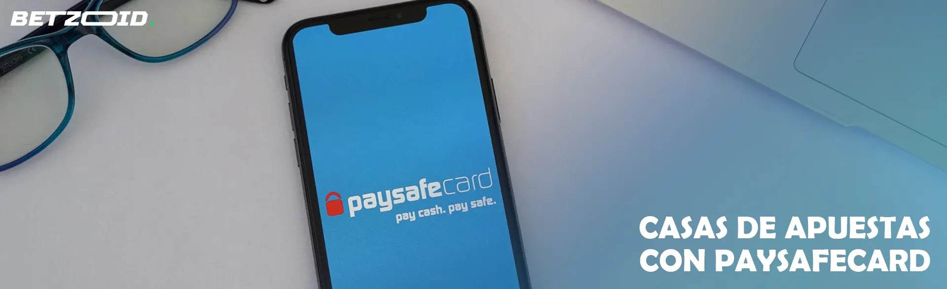 Smartphone con el logo de Paysafecard en pantalla.