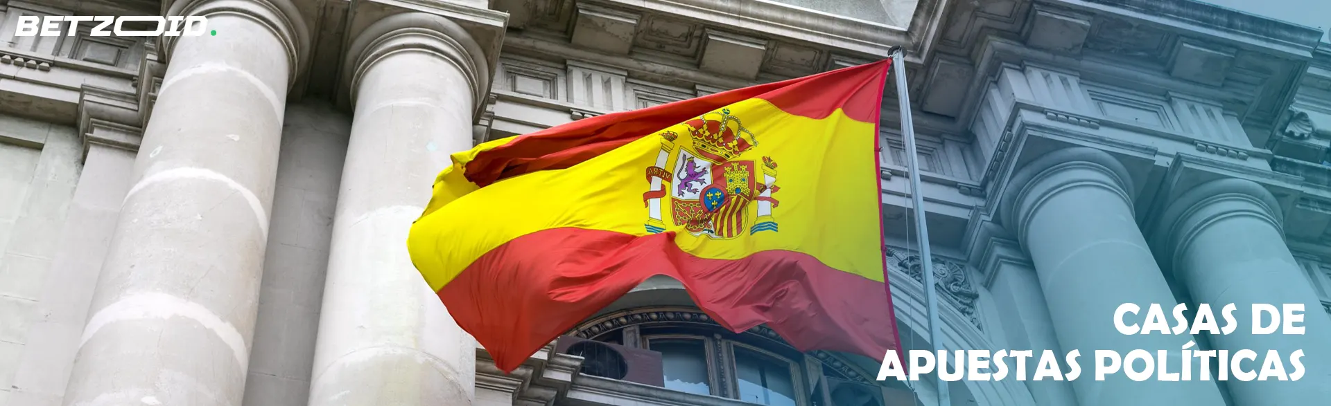 Bandera de España ondeando frente a un edificio.