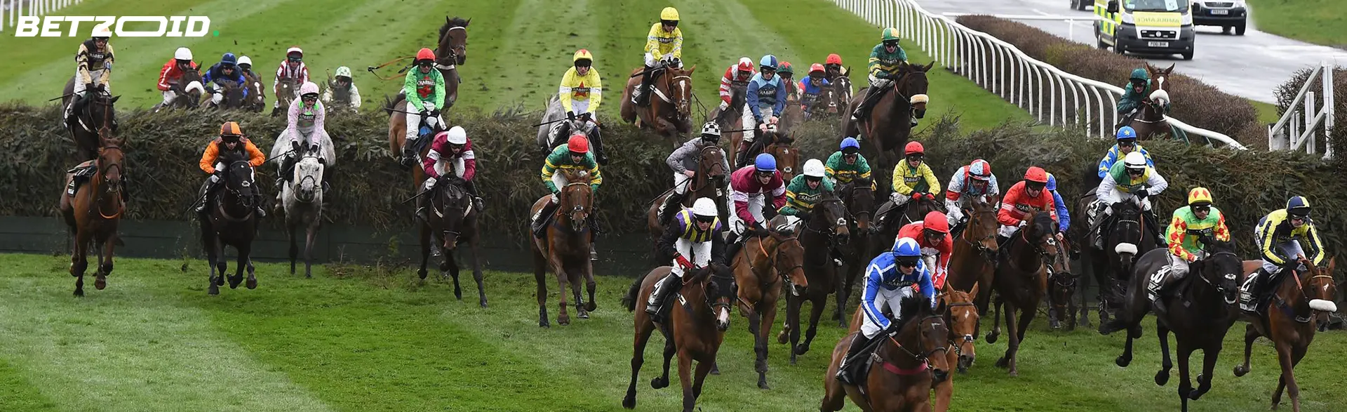 Jockeys on horses during horse racing.