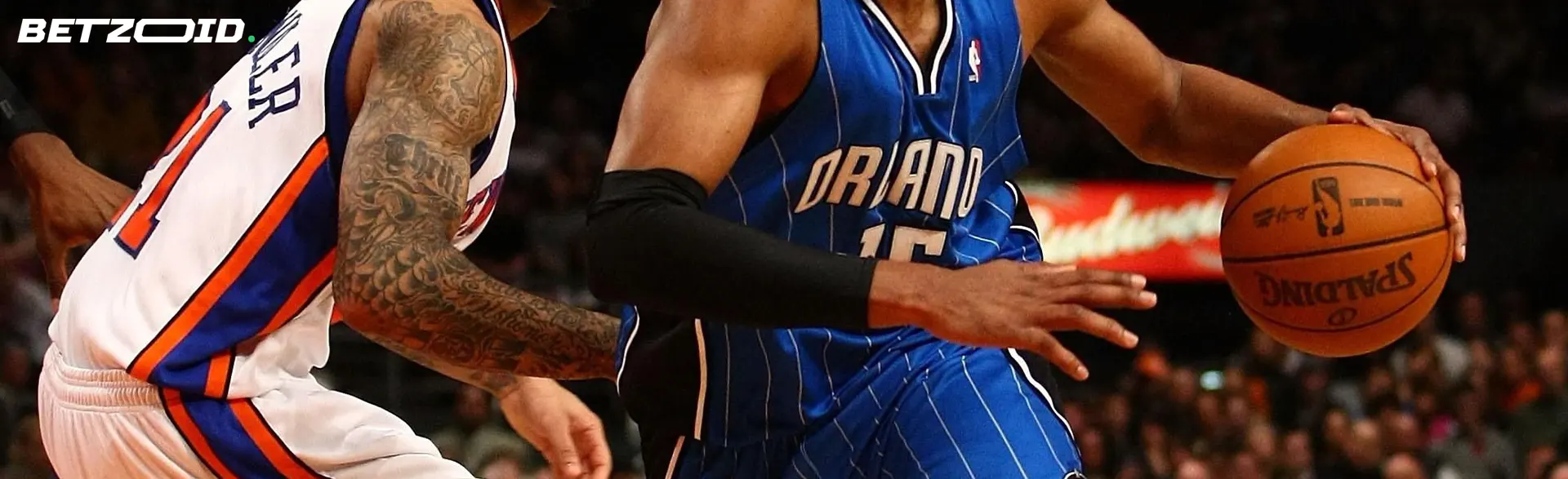 Basketball players fight for the ball during the game.