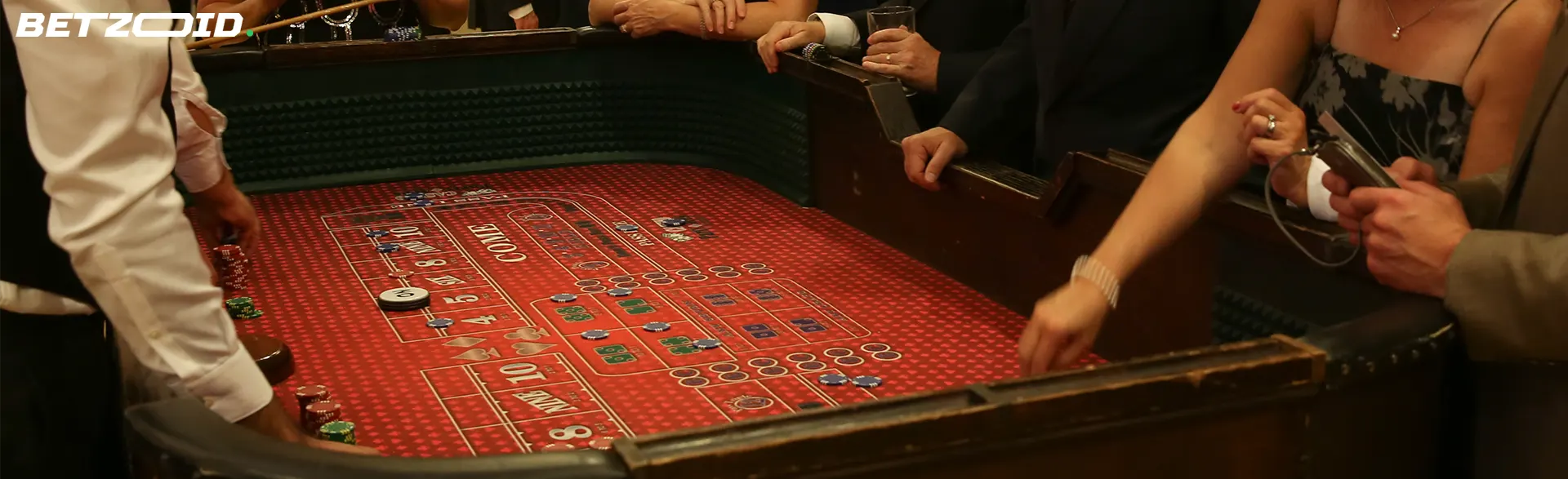 Players gathered around a craps table in a casino, highlighting the lively gaming scene in casinos in New Brunswick, Canada.