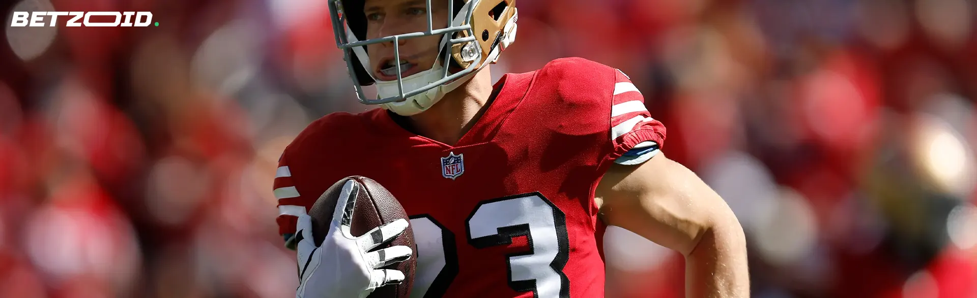 American football player with the ball during the game.