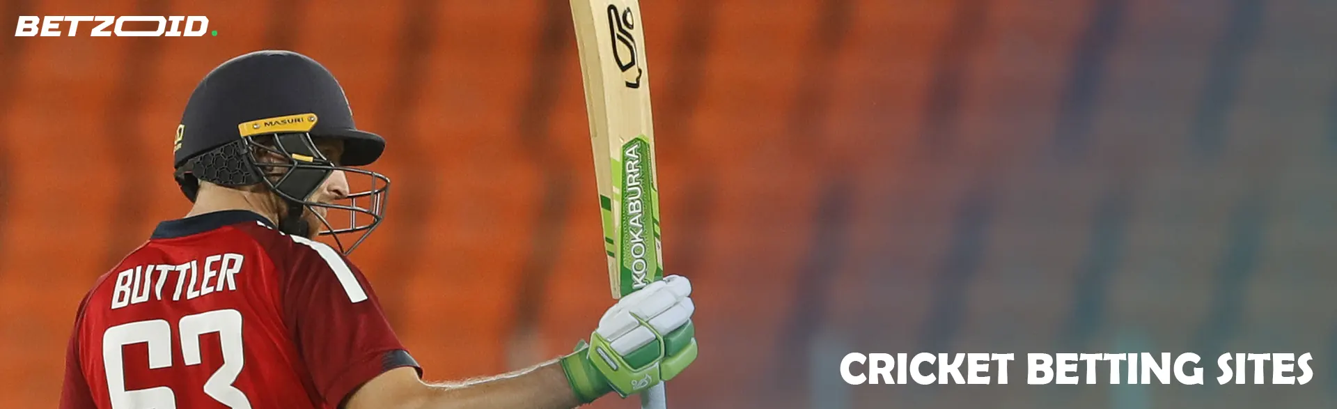 Cricket player on the background of empty stands.